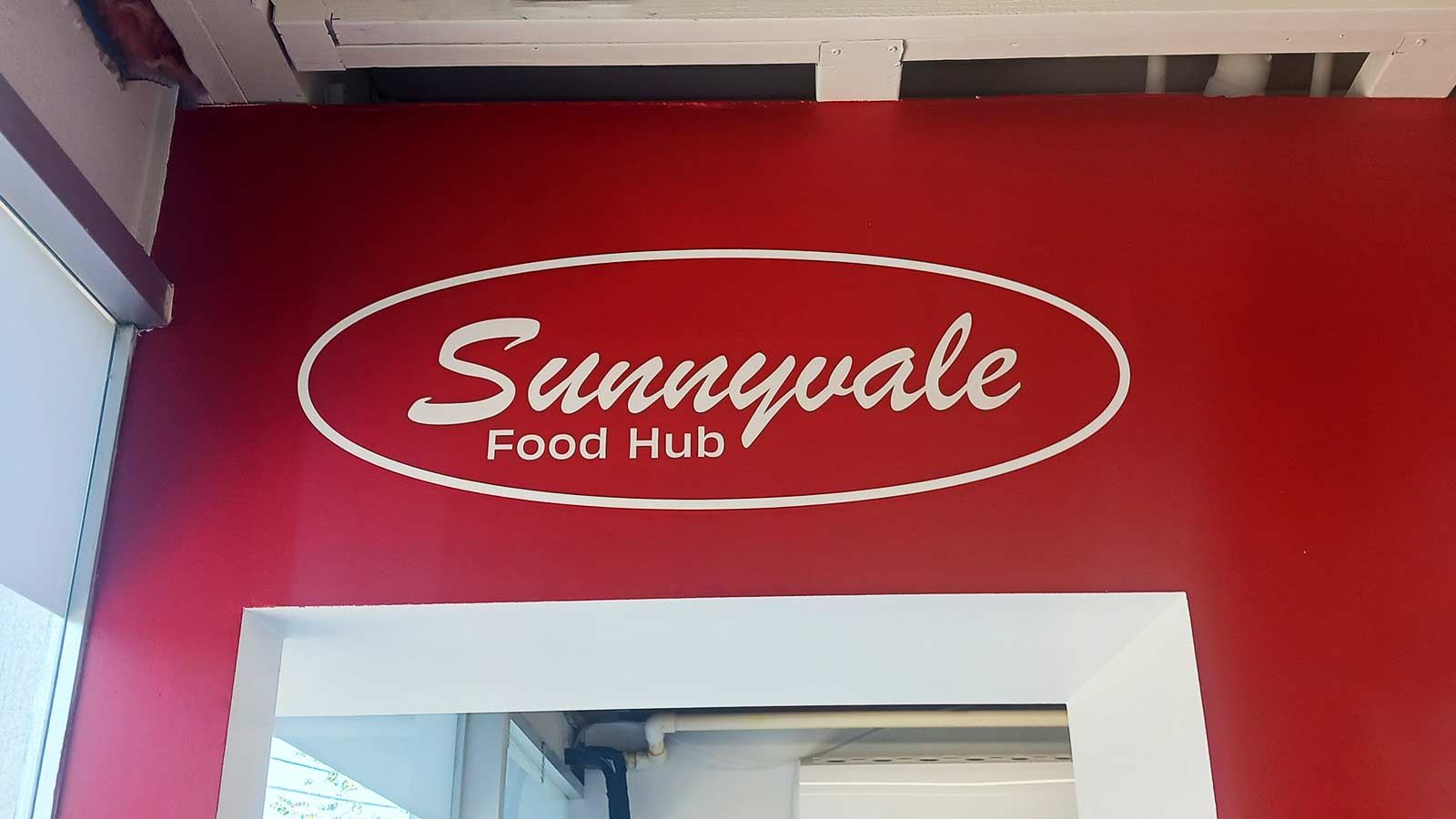 Sunnyvale Food Hub vinyl lettering attached to the wall