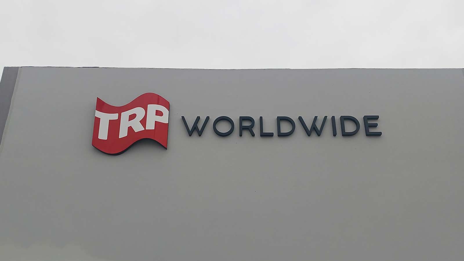 TRP Worldwide outdoor sign mounted on the building