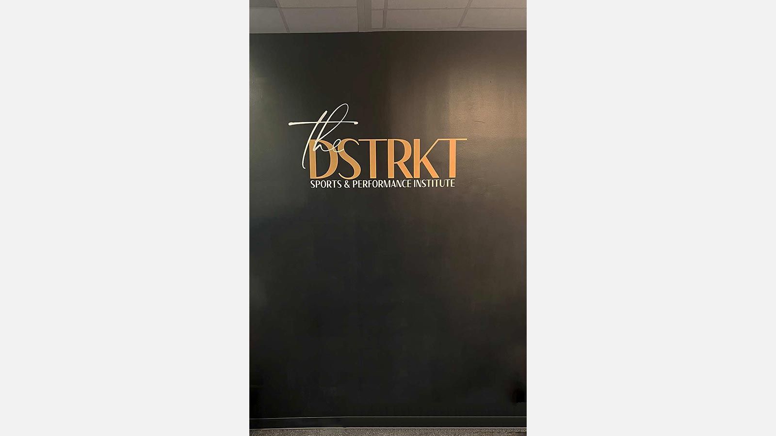 The DSTRKT custom decal attached to the wall