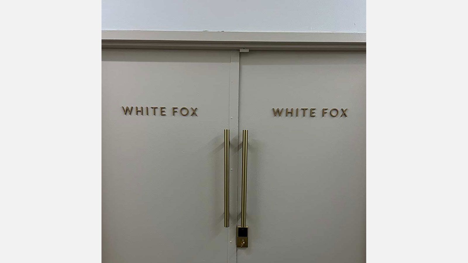 White Fox acrylic signs attached to the doors