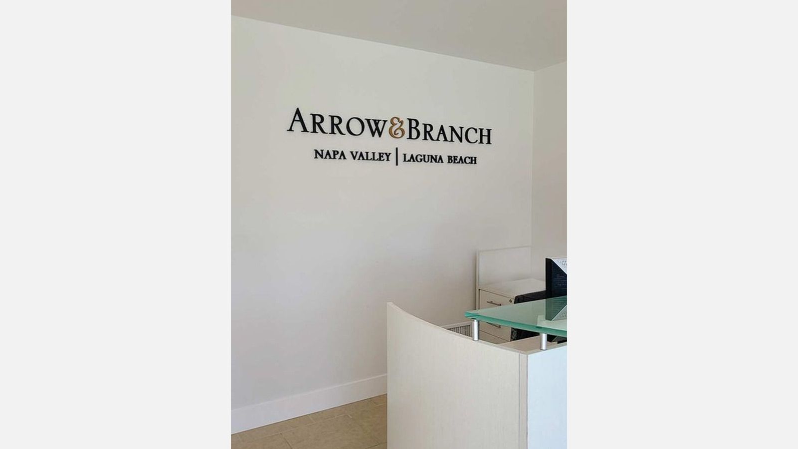 Arrow & Branch lobby sign attached to the wall