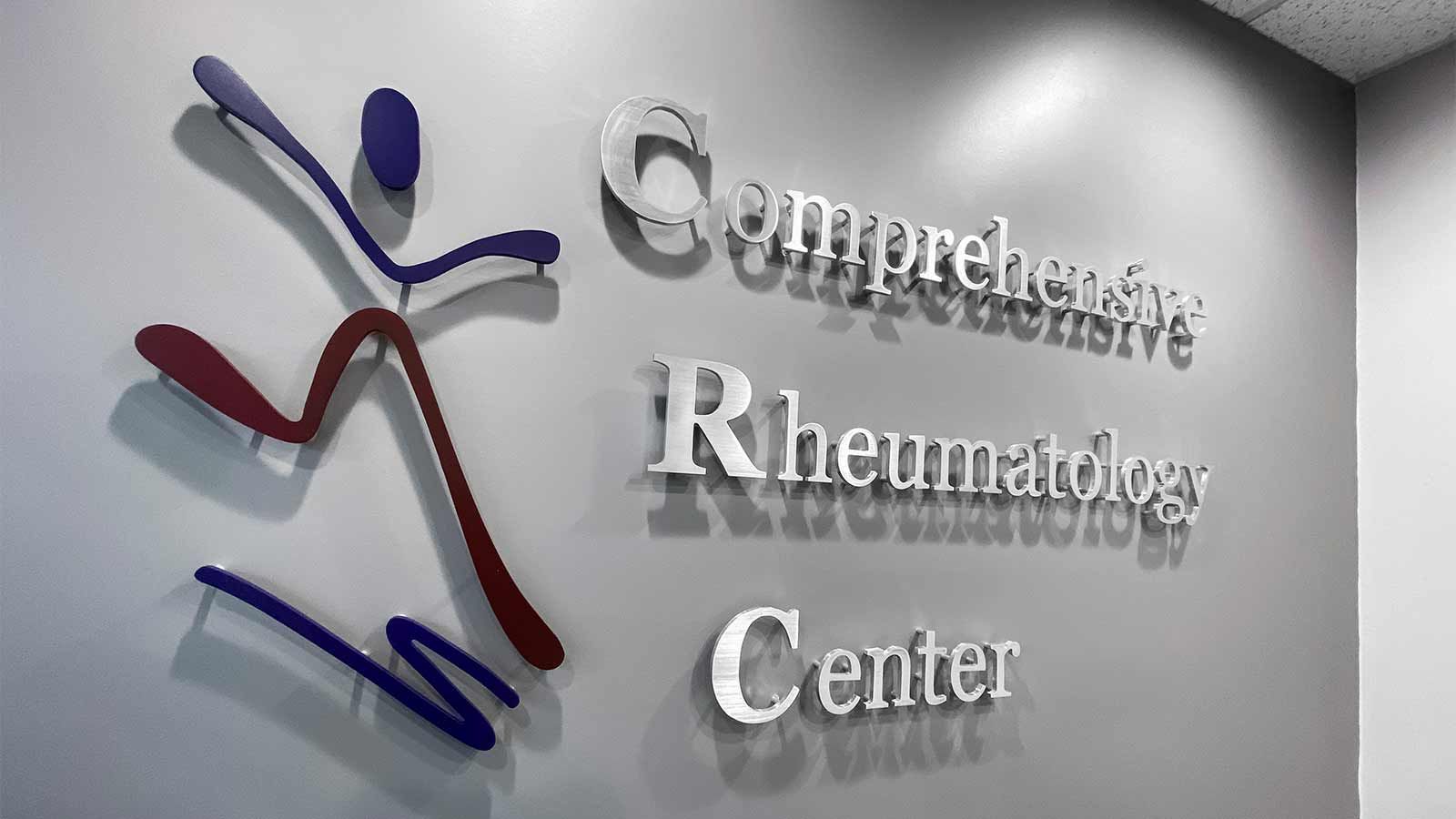 comprehensive rheumatology center pin mounted sign