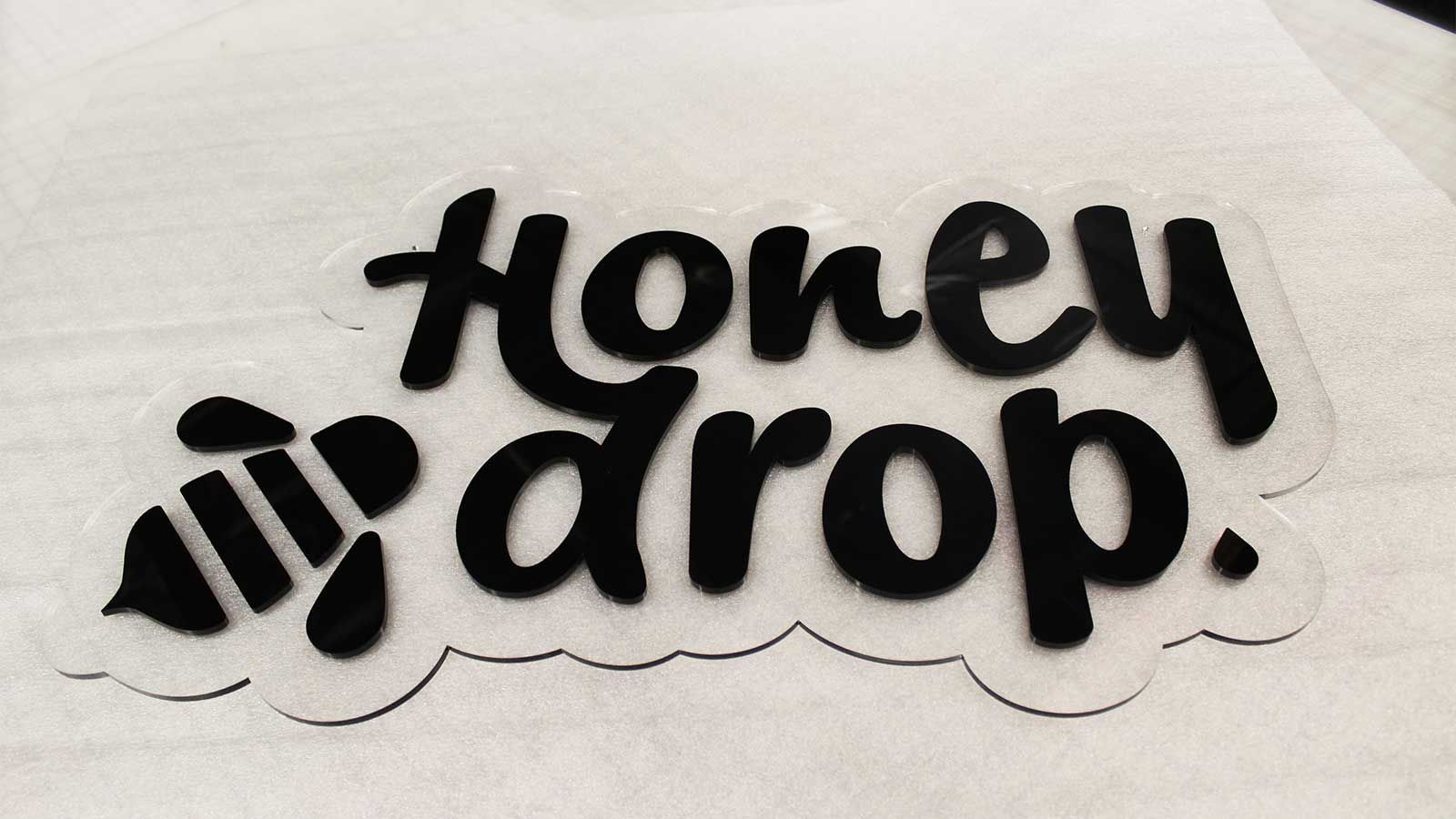honey drop cast acrylic logo sign