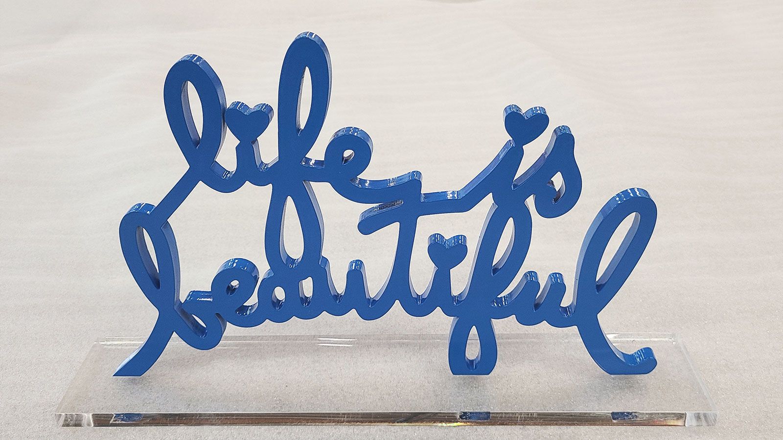 painted blue decorative freestanding sign