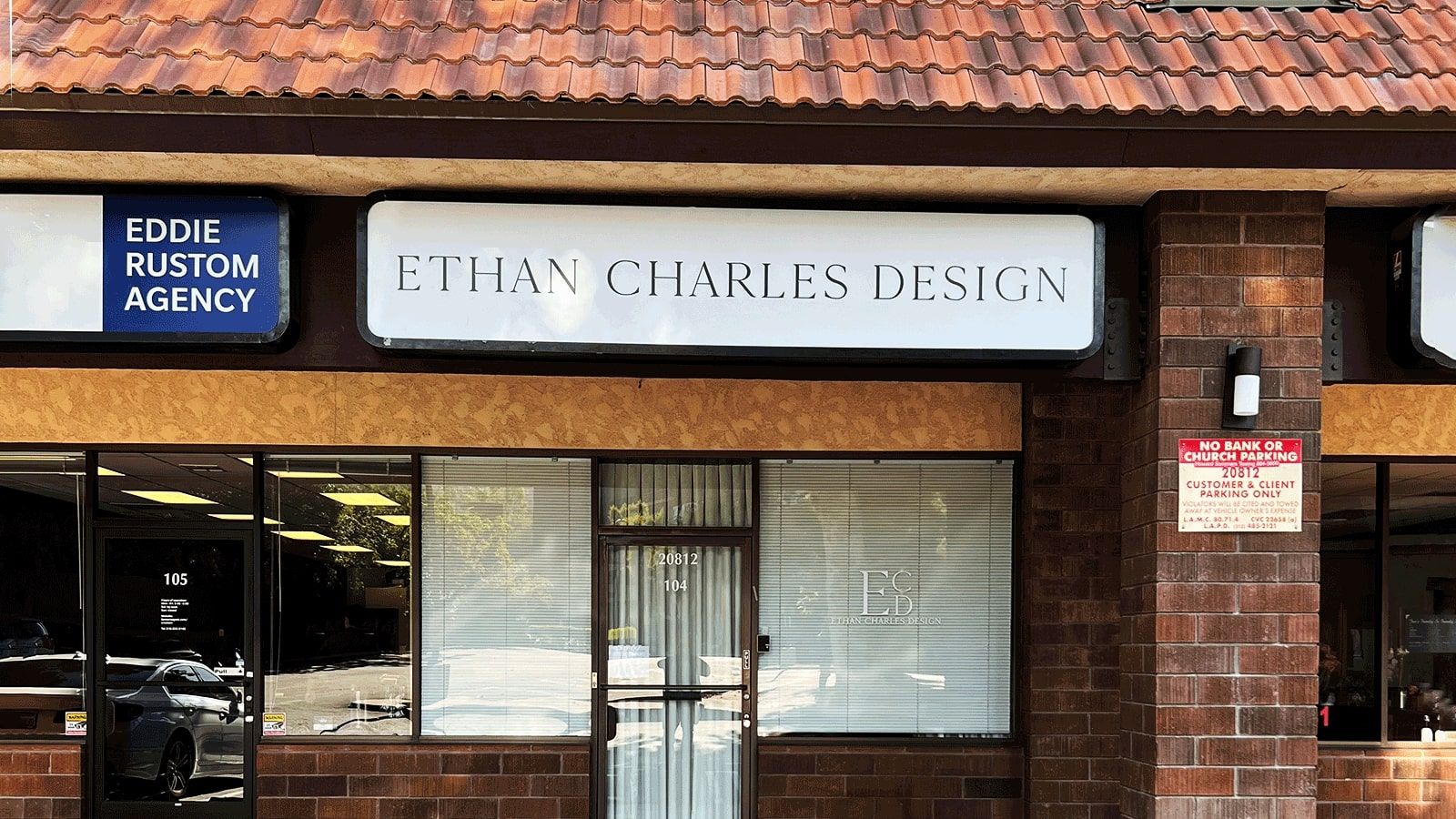 Ethan Charles Design light box sign installed on the facade