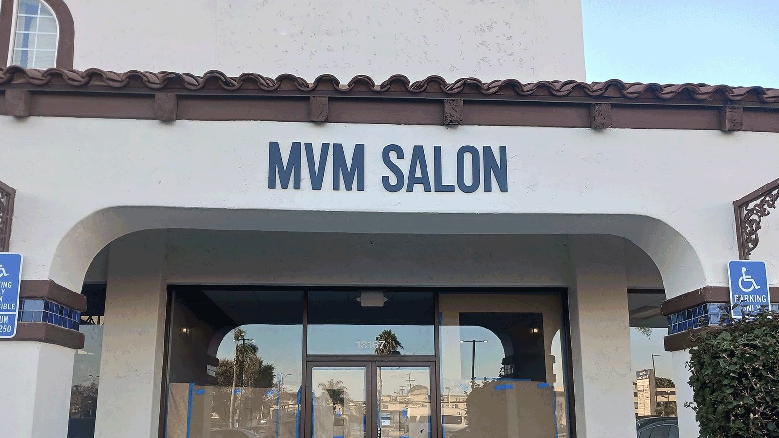 MVM Salon outdoor sign attached to the facade