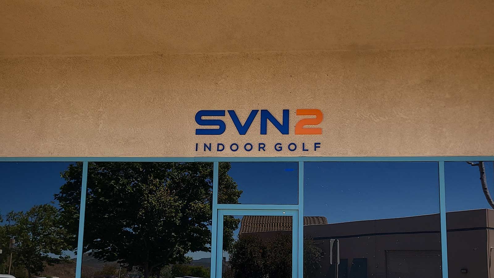 SCRTCH Golf LLC acrylic sign mounted on the facade