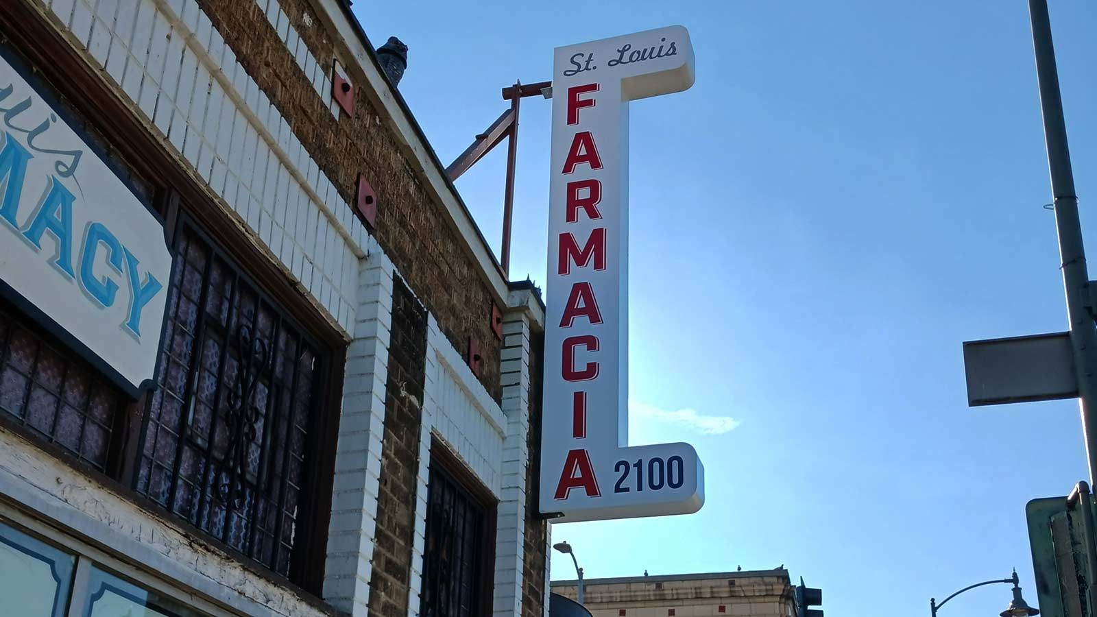 St Louis Drug Company aluminum blade sign set up outdoors