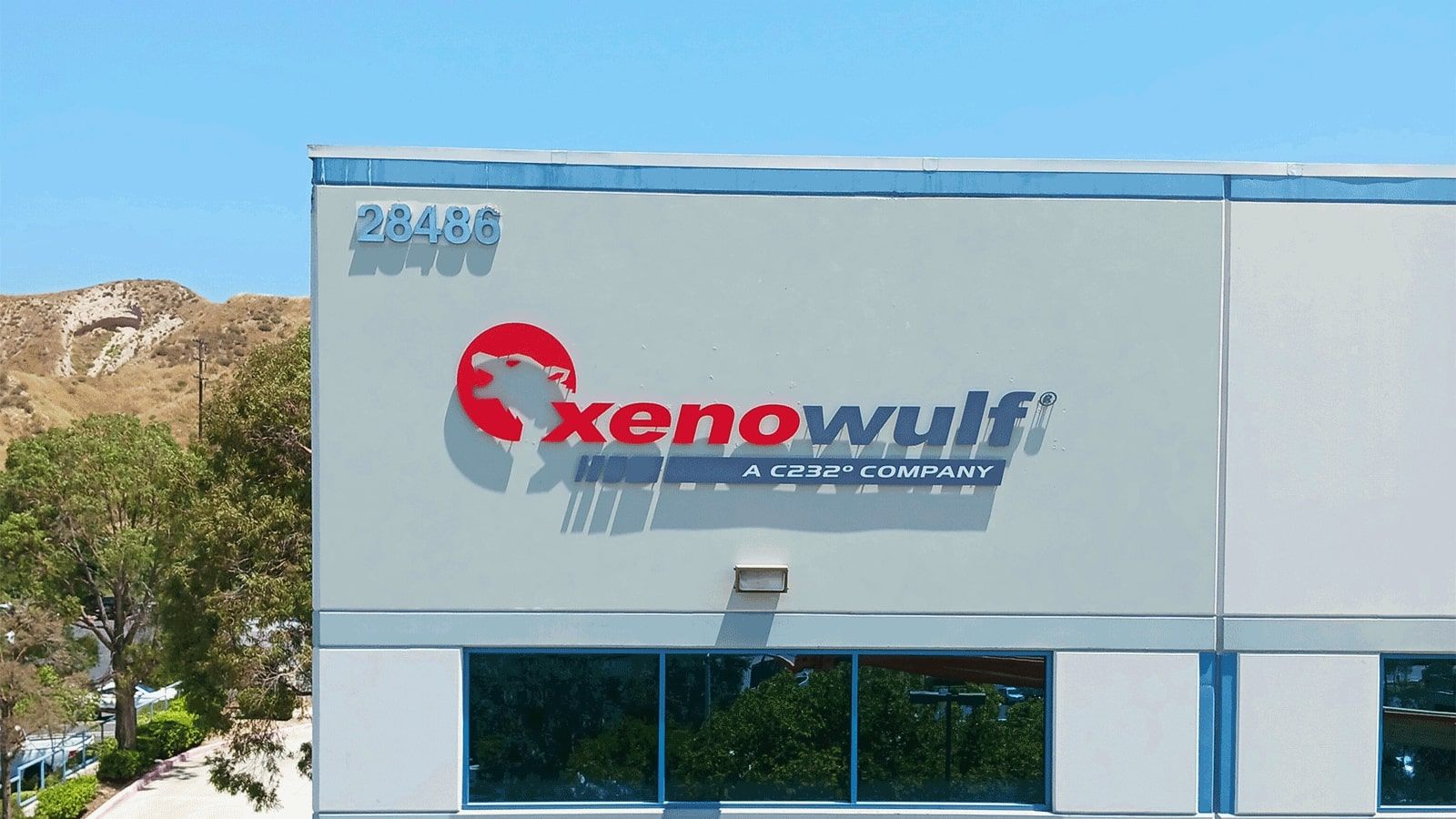 Xeno Wulf PVC sign attached to the facade