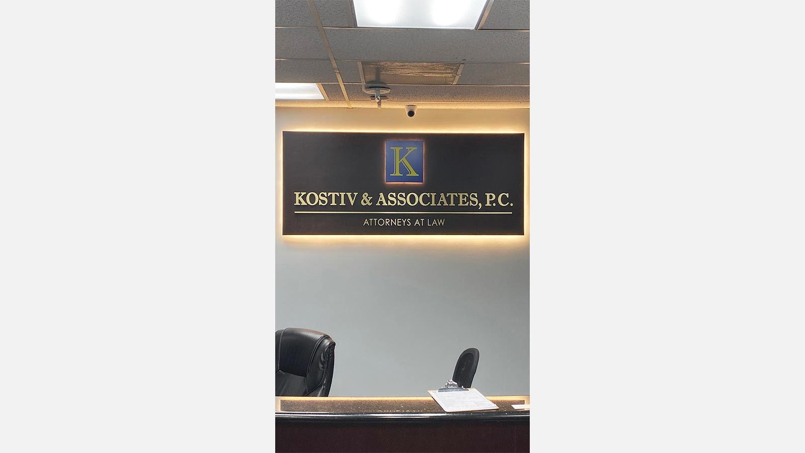 kostiv and associates backlit office sign