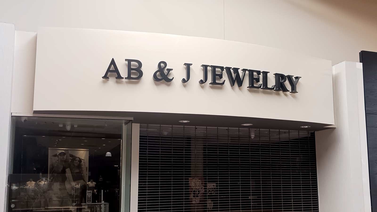 AB & J Jewelry building sign attached to the facade