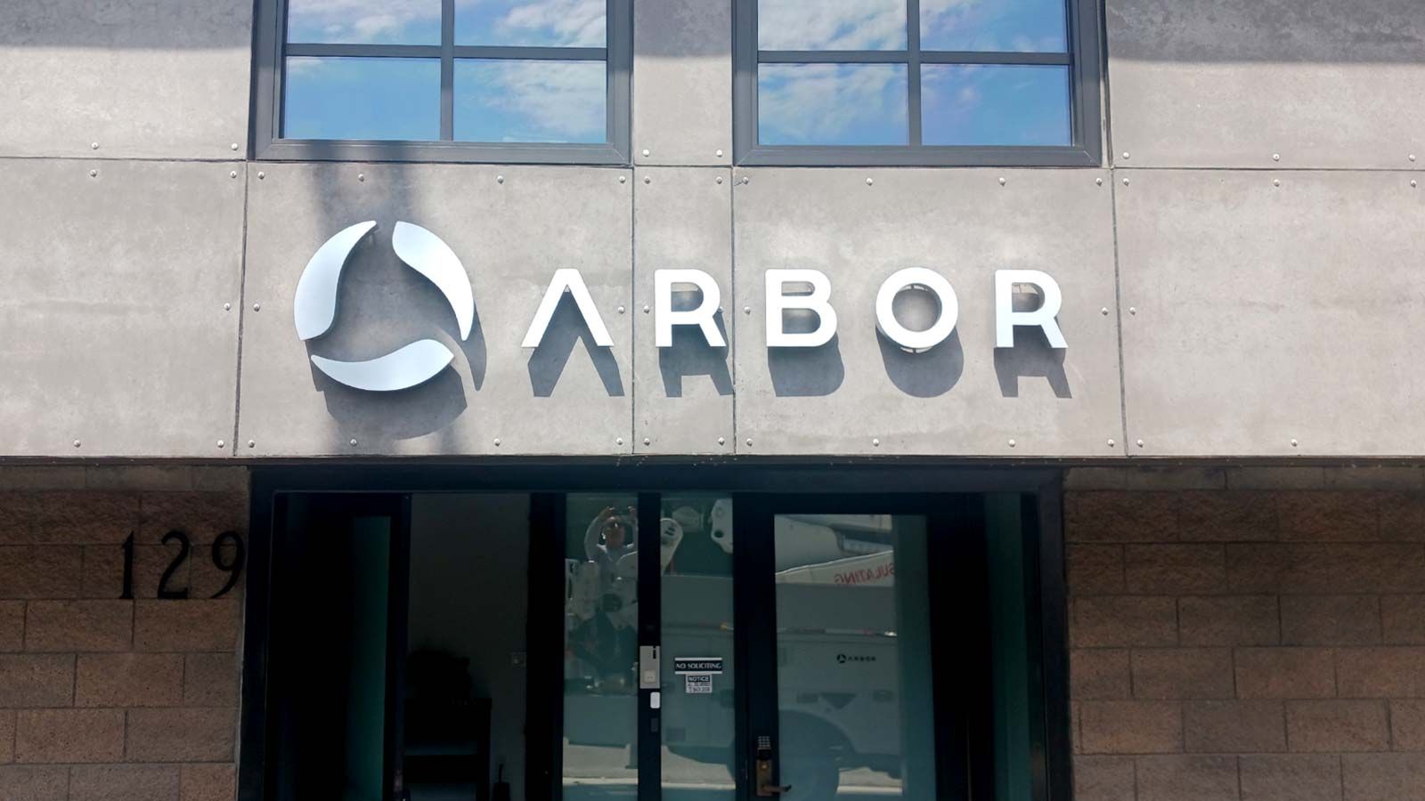 Arbor Energy reverse channel letters set up on the facade