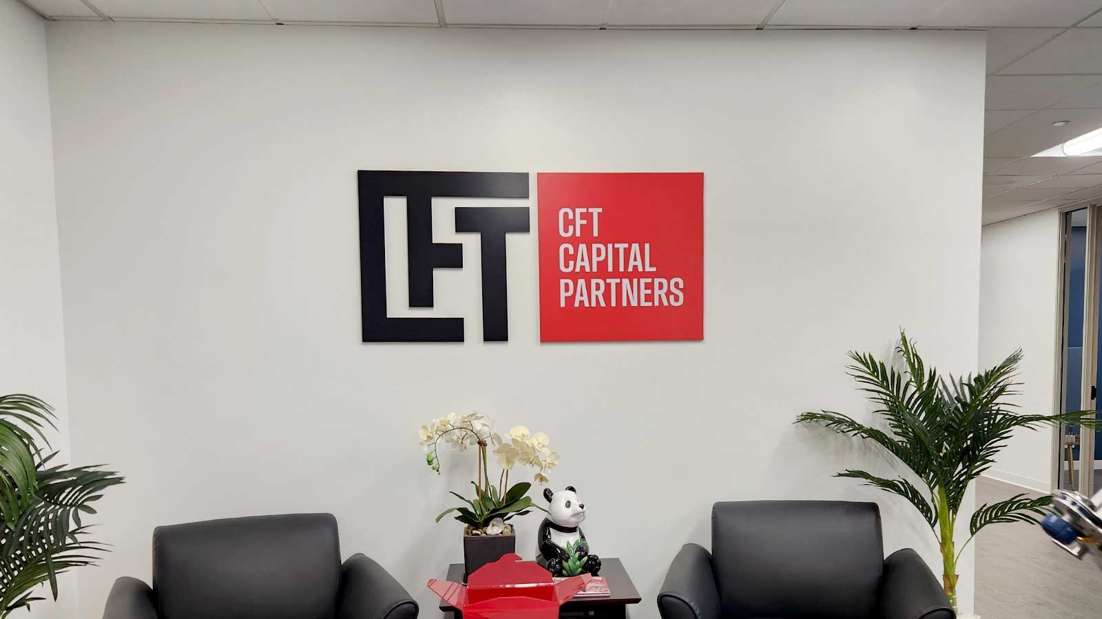 CFT Capital Partners acrylic signs attached to the wall