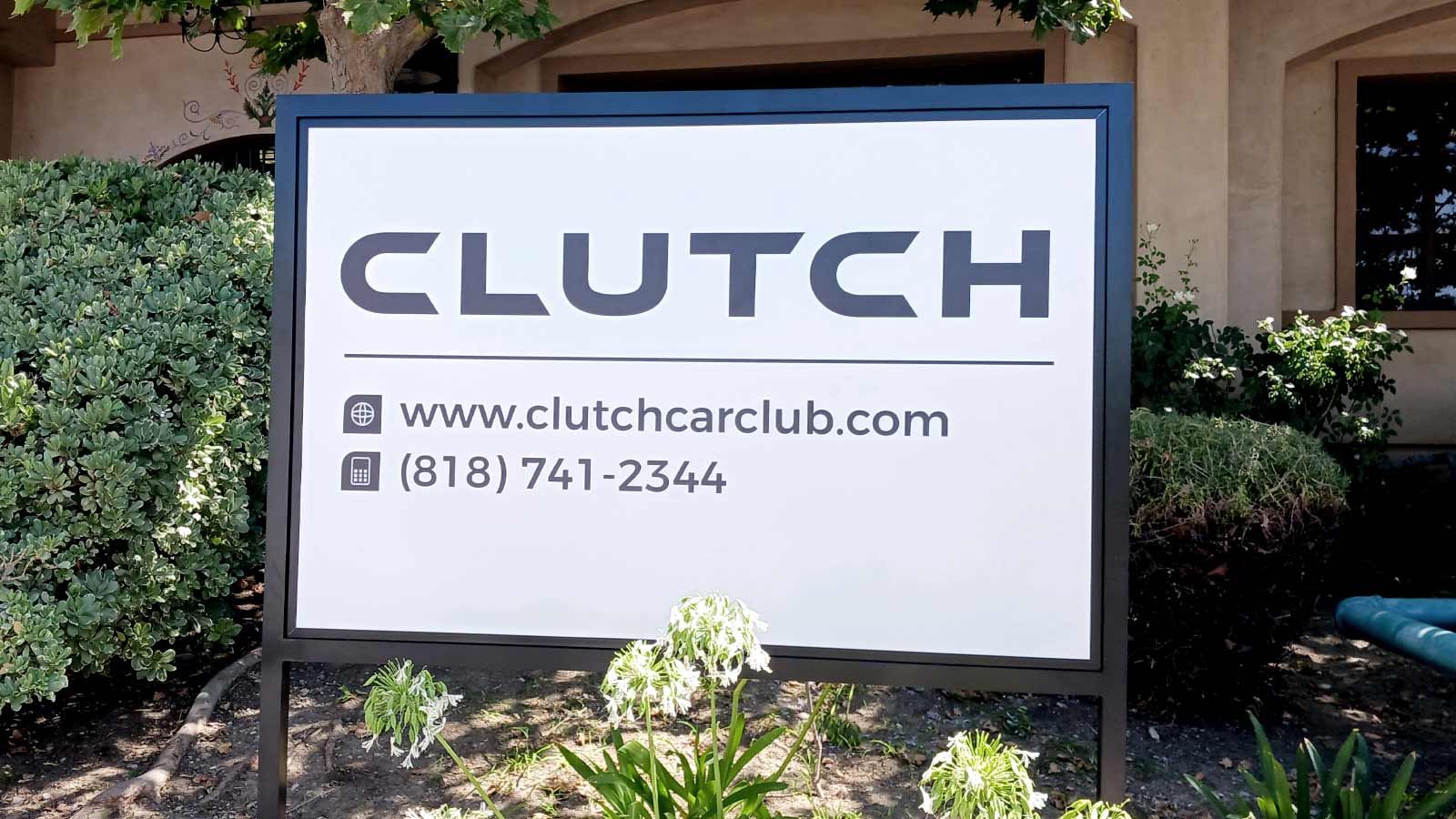 Clutch Car Club yard sign installed outdoors