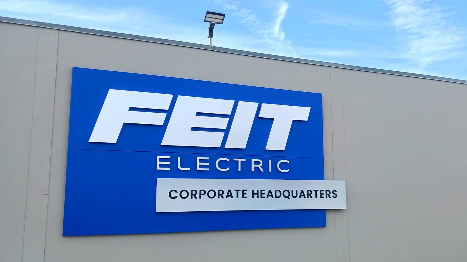 Feit Electric building top sign
