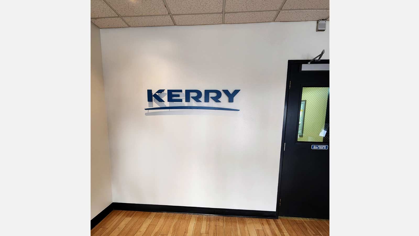 Kerry office sign mounted on the wall