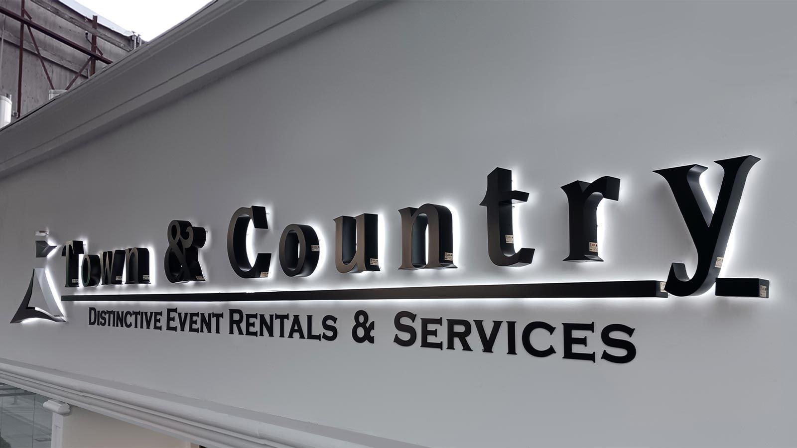 Town & Country backlit letters mounted on the facade