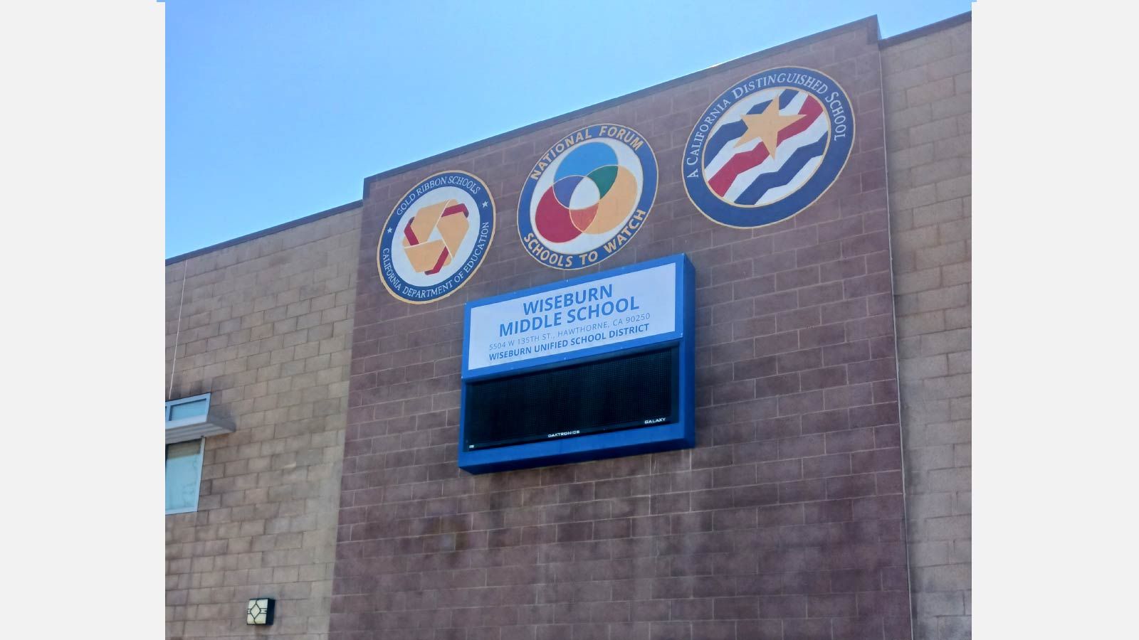 Wiseburn Middle School banner put up high on the building
