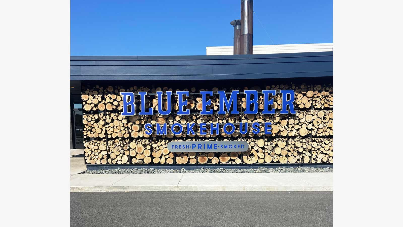 Blue Ember Smokehouse outdoor signs on the wall