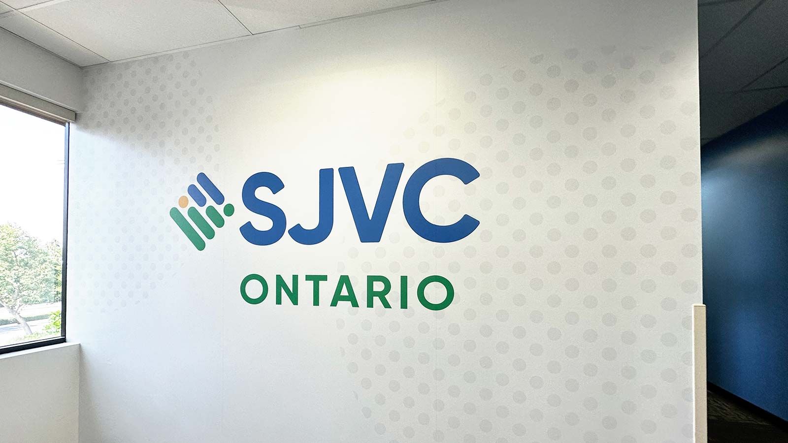 SJVC Ontario interior sign attached to the wall