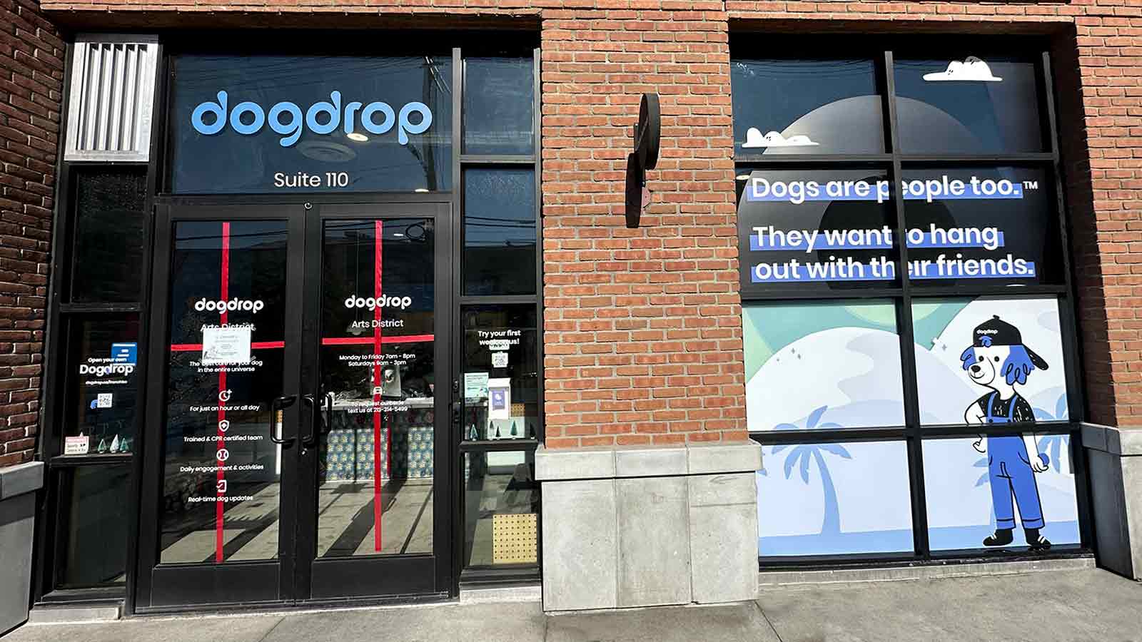 Dogdrop window decals applied to the storefront