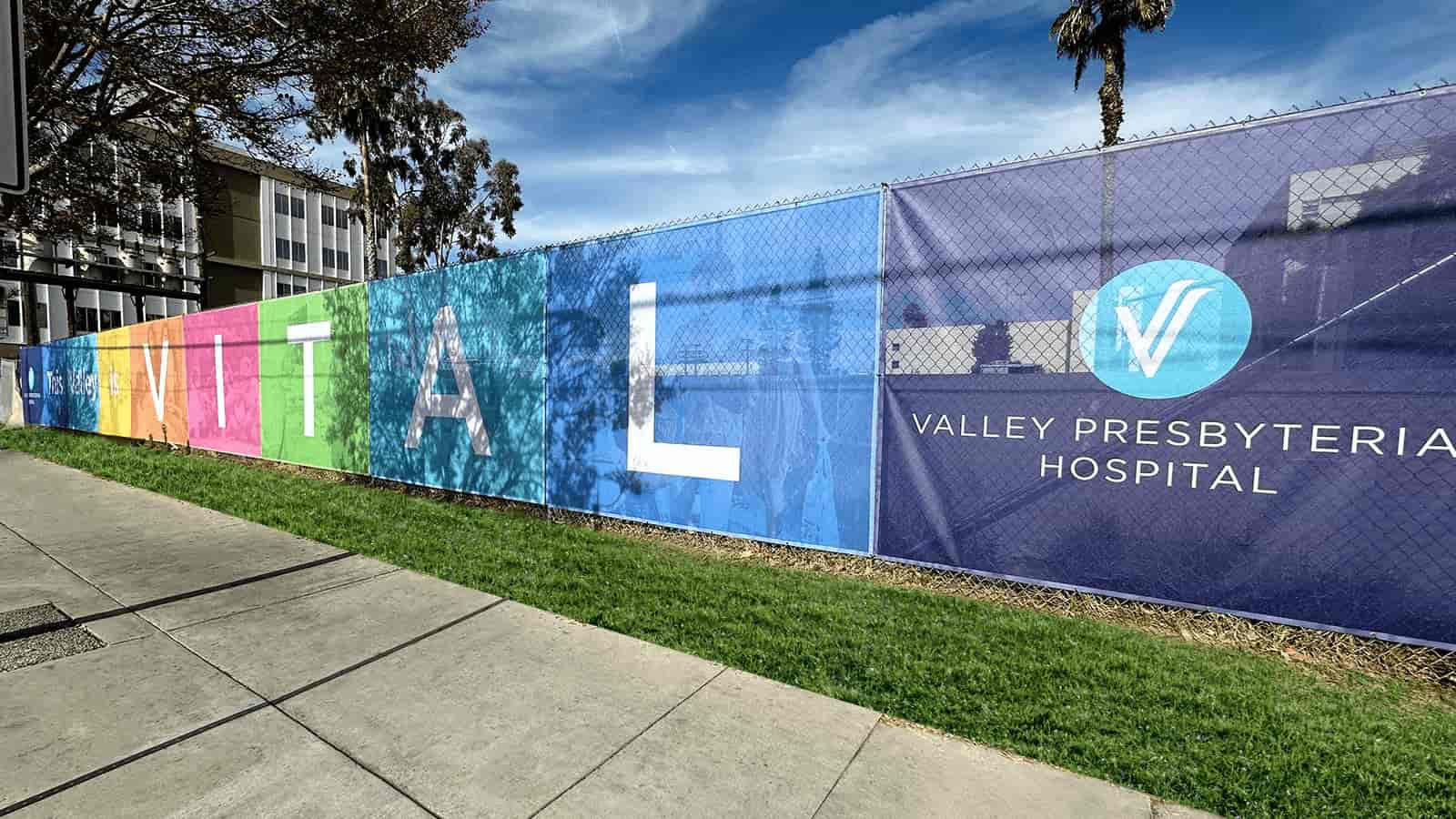 Valley Presbyterian Hospital banners hanging on the fence