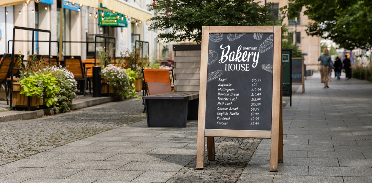Classic bakery signage design installed outdoors featuring the menu list of the bakery