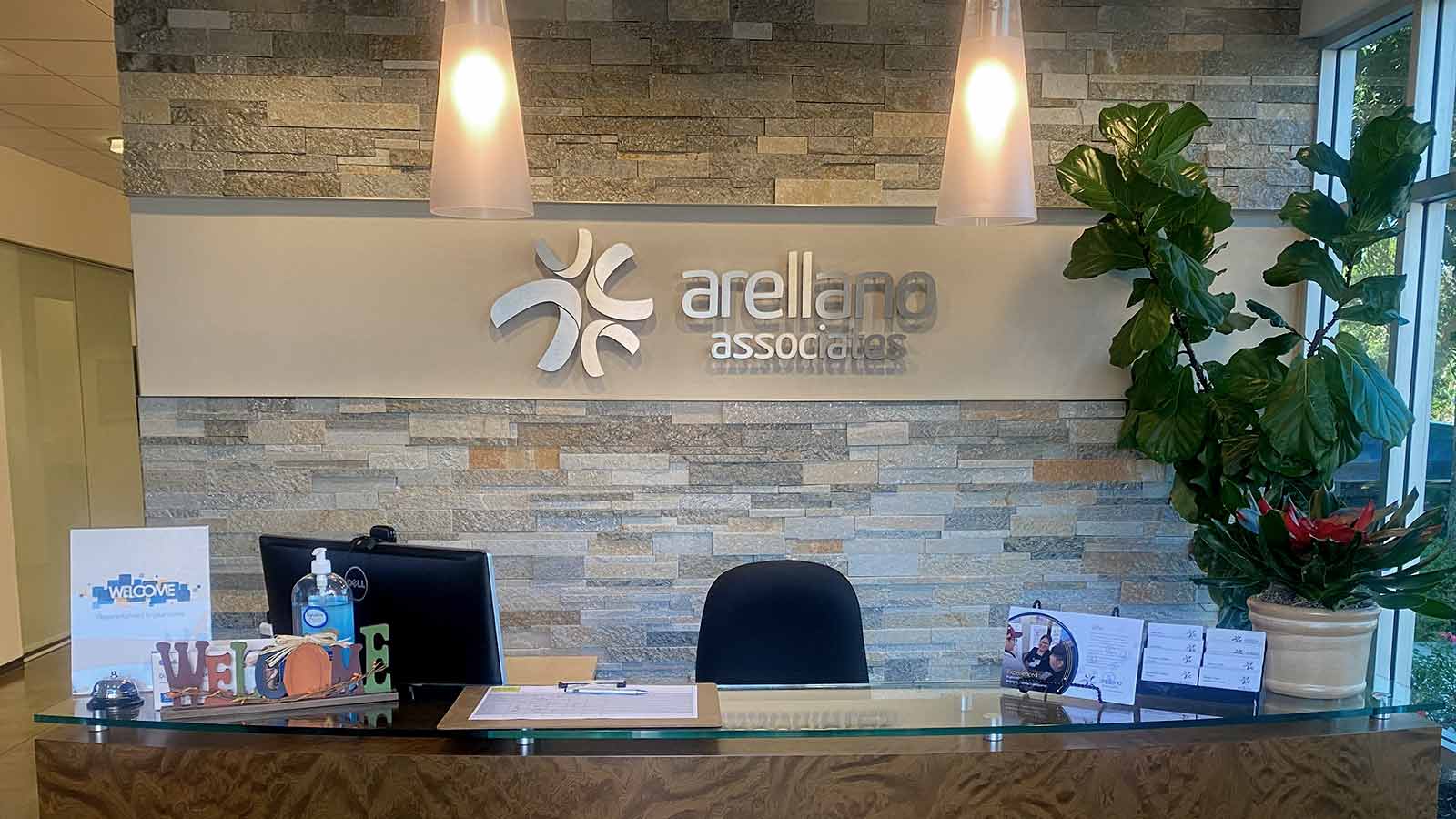 arellano associates office signs installed on the lobby wall