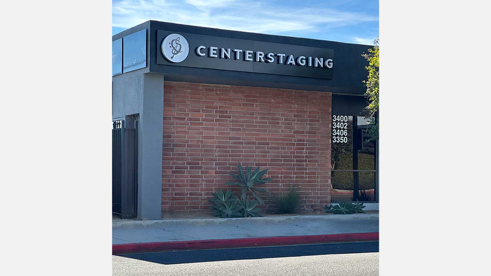 centerstaging llc building signs installed on the facade