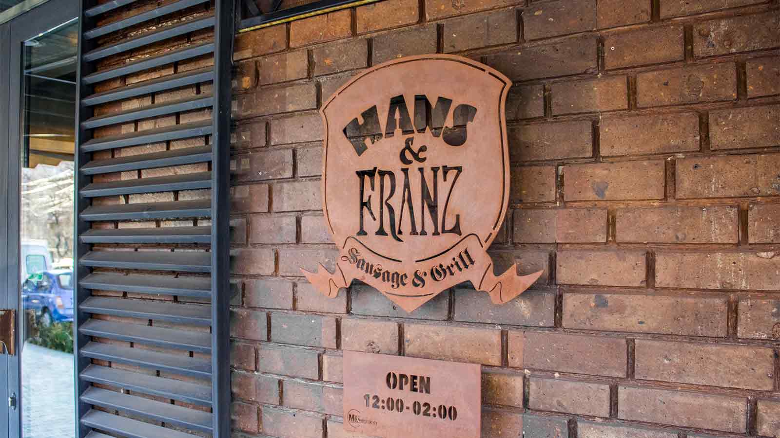 hans and franz aluminum logo signage