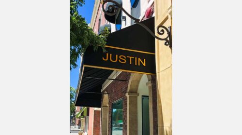 Aluminum awning sign for our partners at Justin | Front Signs