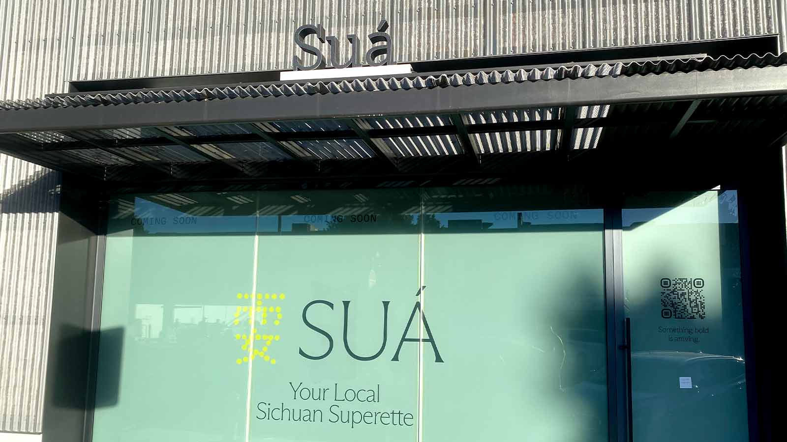 sua superette store signs installed outdoors