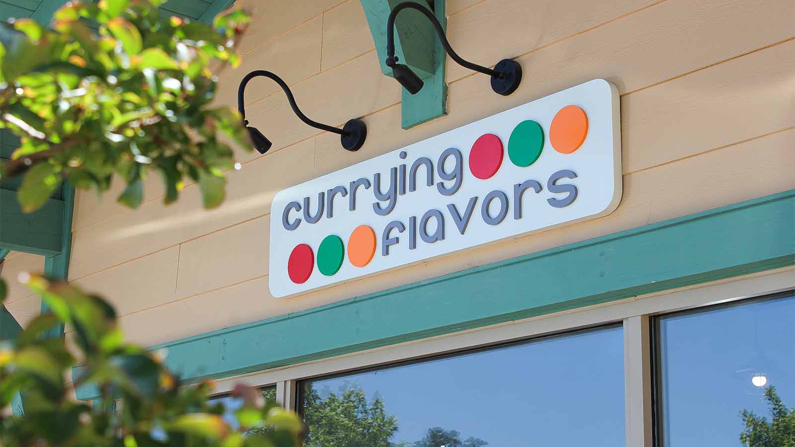 carrying flavors colorful restaurant sign