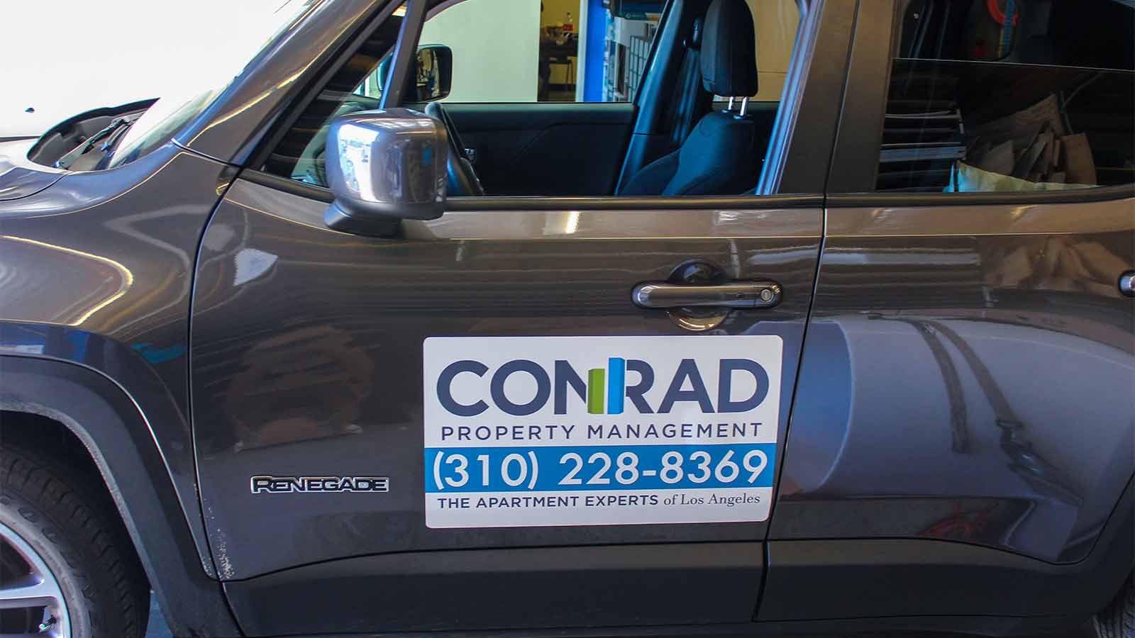 conrad property management car magnet sign