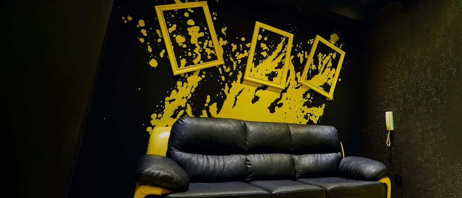 Crafty painted wall murals in yellow and black applied on an inside wall for decoration
