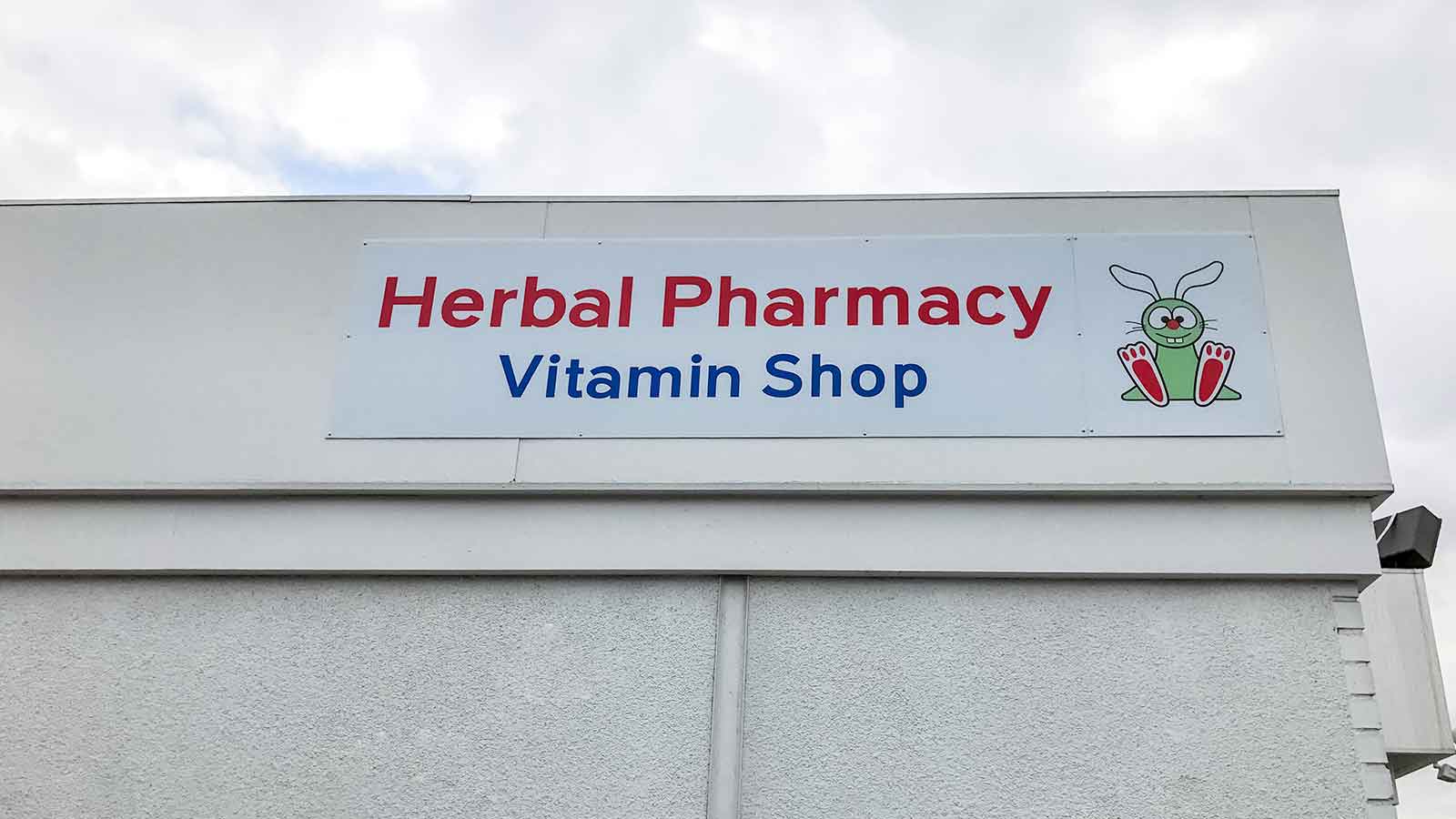 herbal pharmacy high-rise coroplast signs