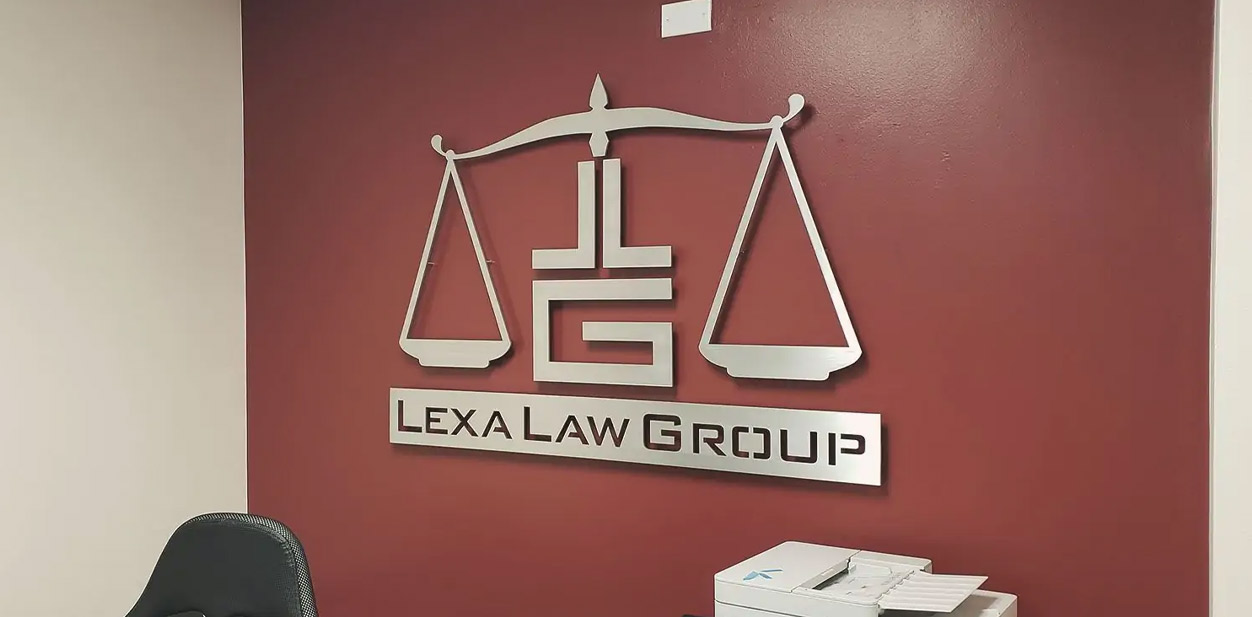 Metallic modern law firm design with brand initials making up the base of a balance scale.