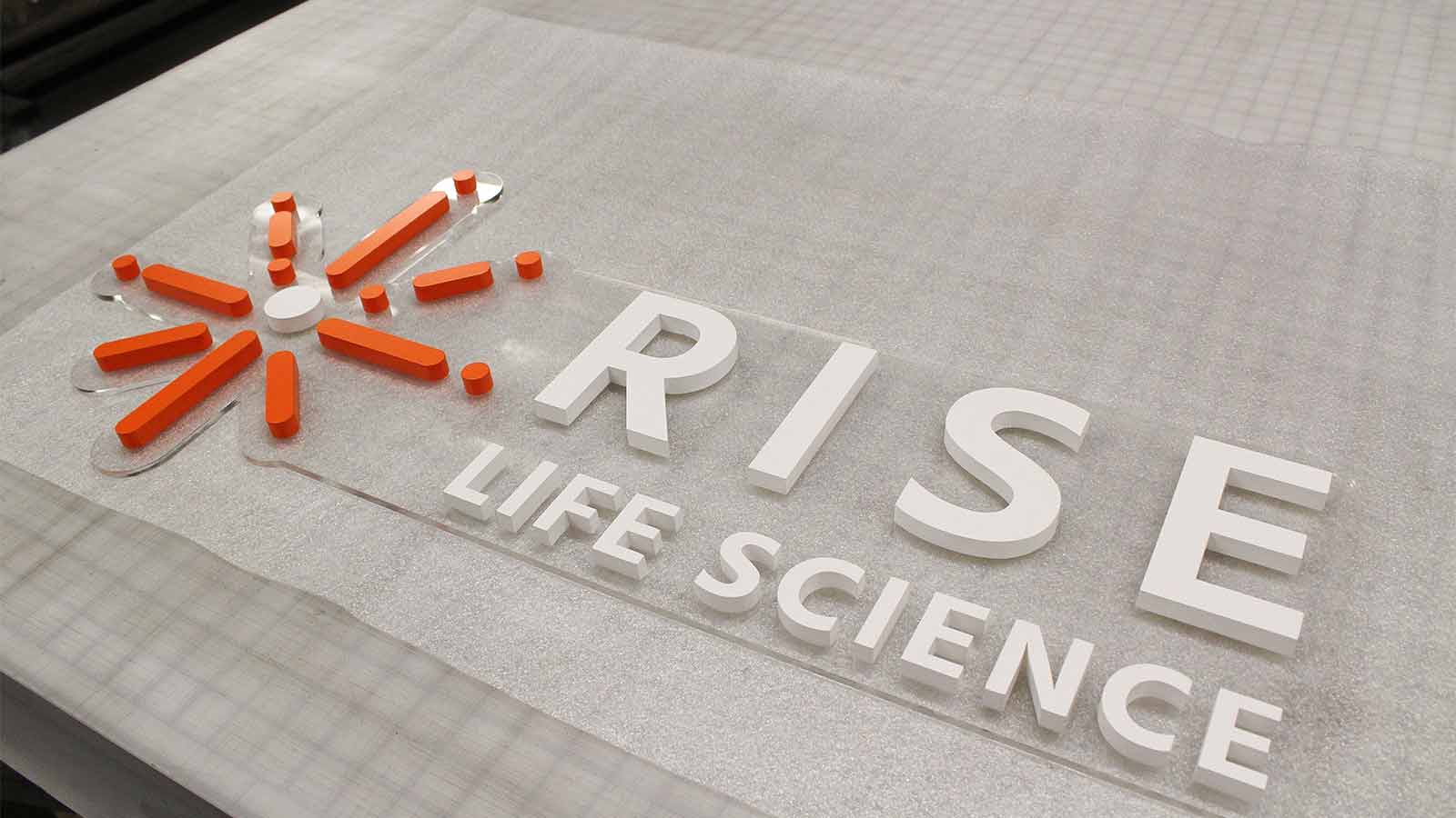 rise life science acrylic logo sign