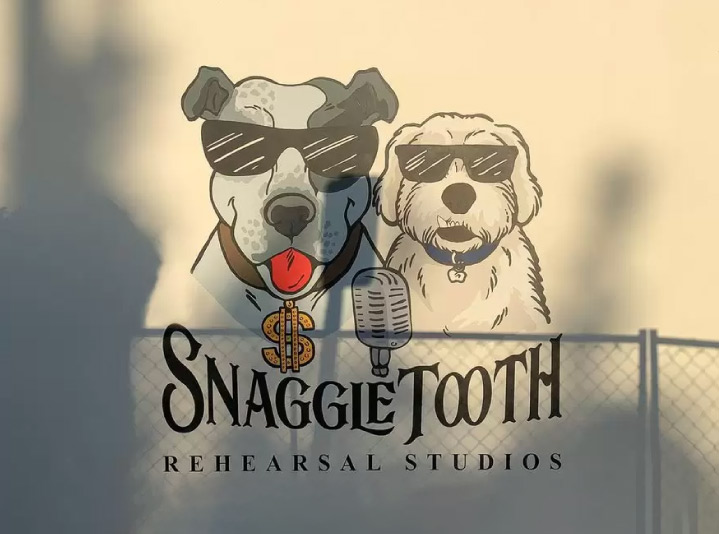 Snaggle Tooth painted murals created with black, white, red and other paints for branding