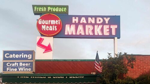 handy market building sign installation outdoors