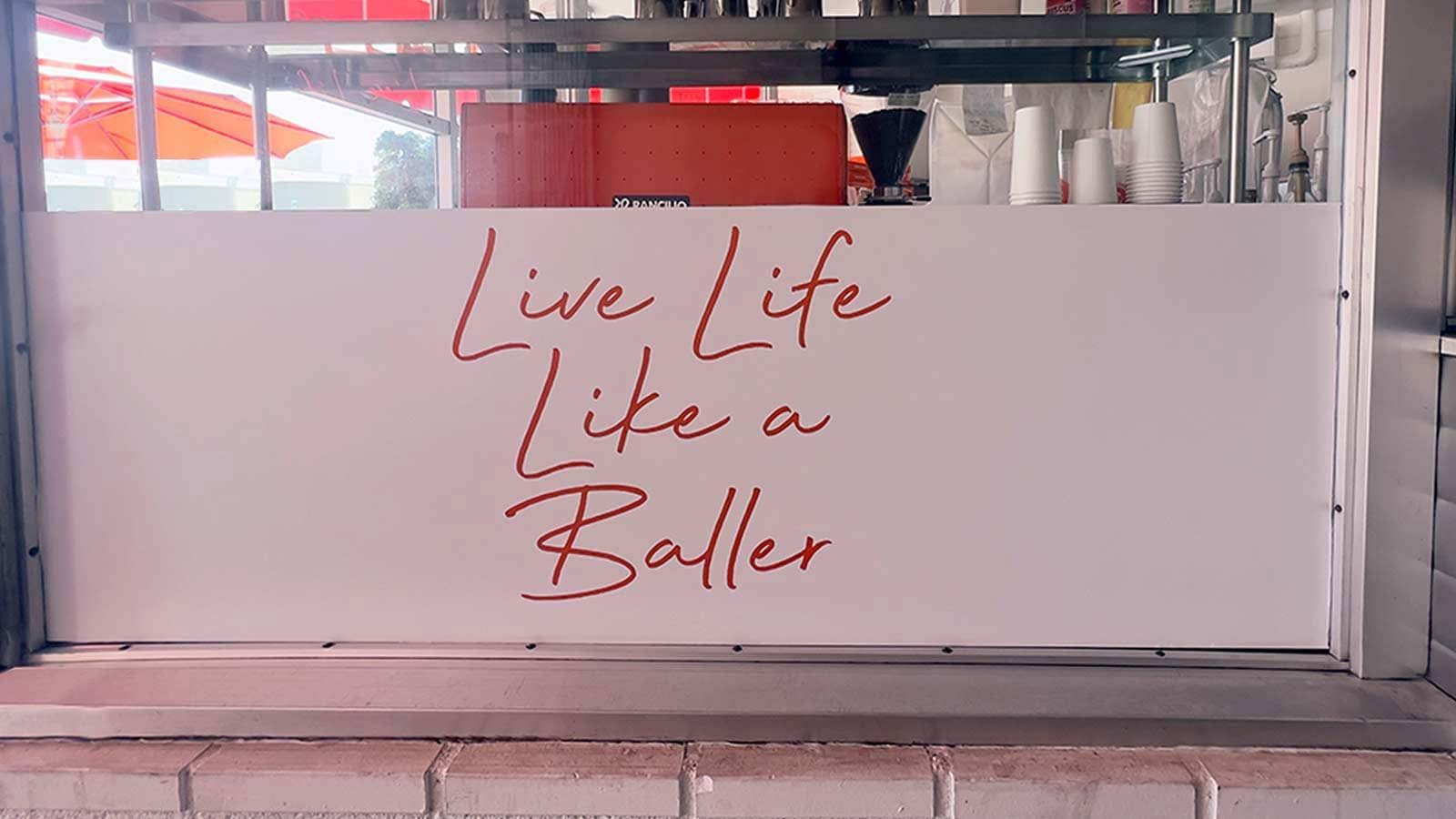 live life like baller store sign