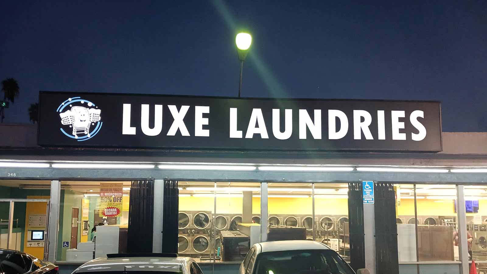 luxe laundries illuminated sign