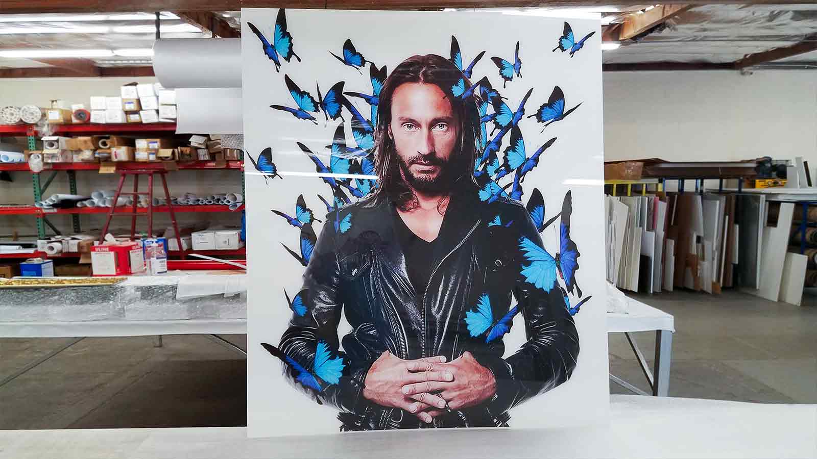 man with butterflies print acrylic sign