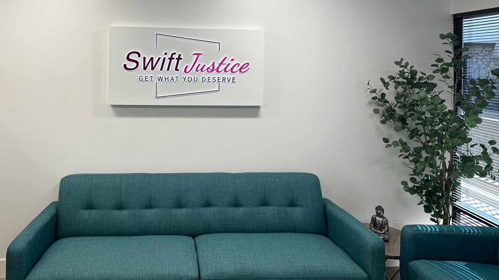 swift justice inc lobby sign installed at the reception