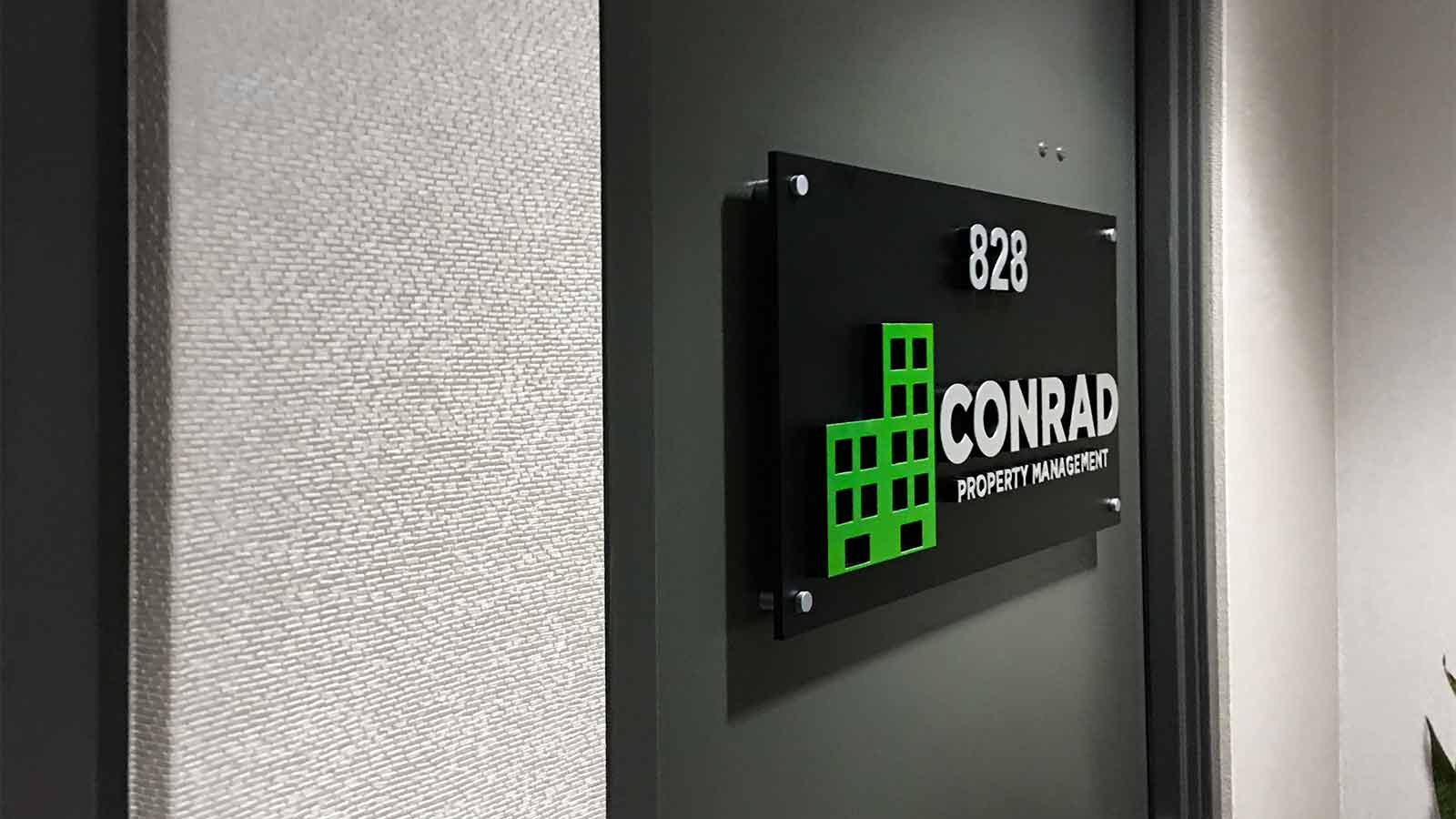 conrad property management acrylic standoff sign