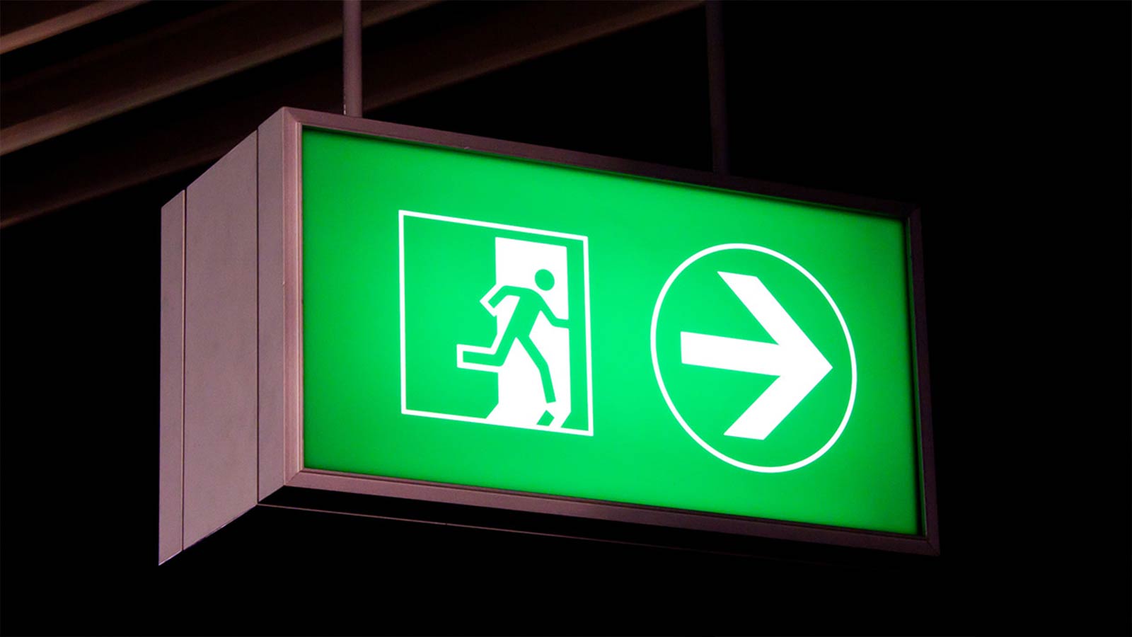 green exit directional lightbox sign