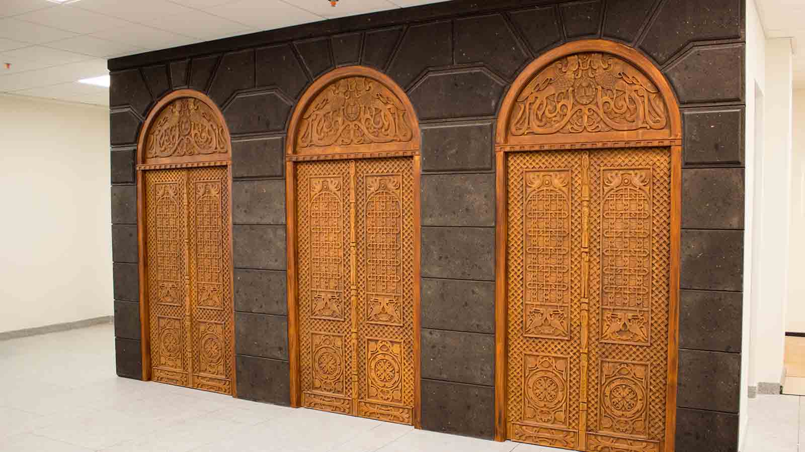 ornate wooden doors with custom engraving