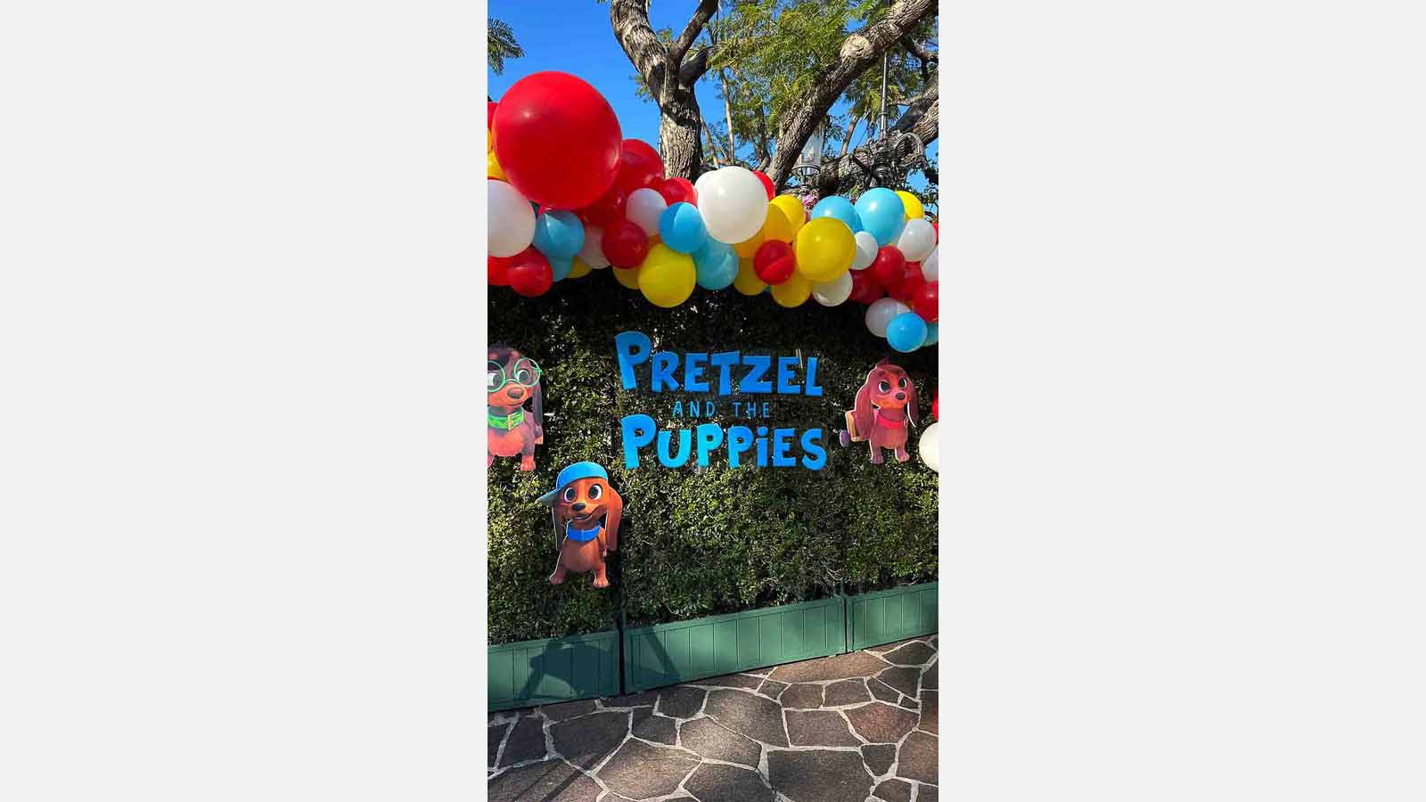 pretzel and the puppies event sign