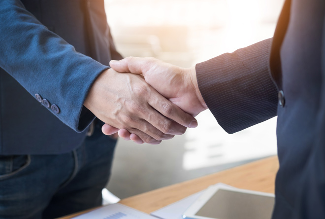 Front Signs, a sign making company – business partners shaking hands