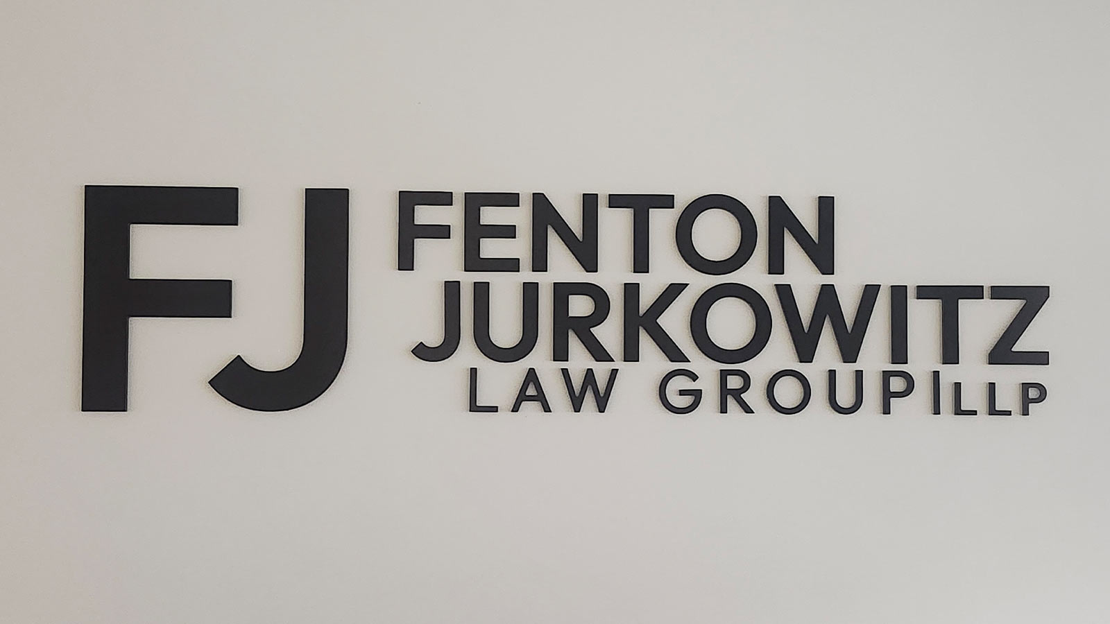 fenton jurkowitz law group logo display installed indoors